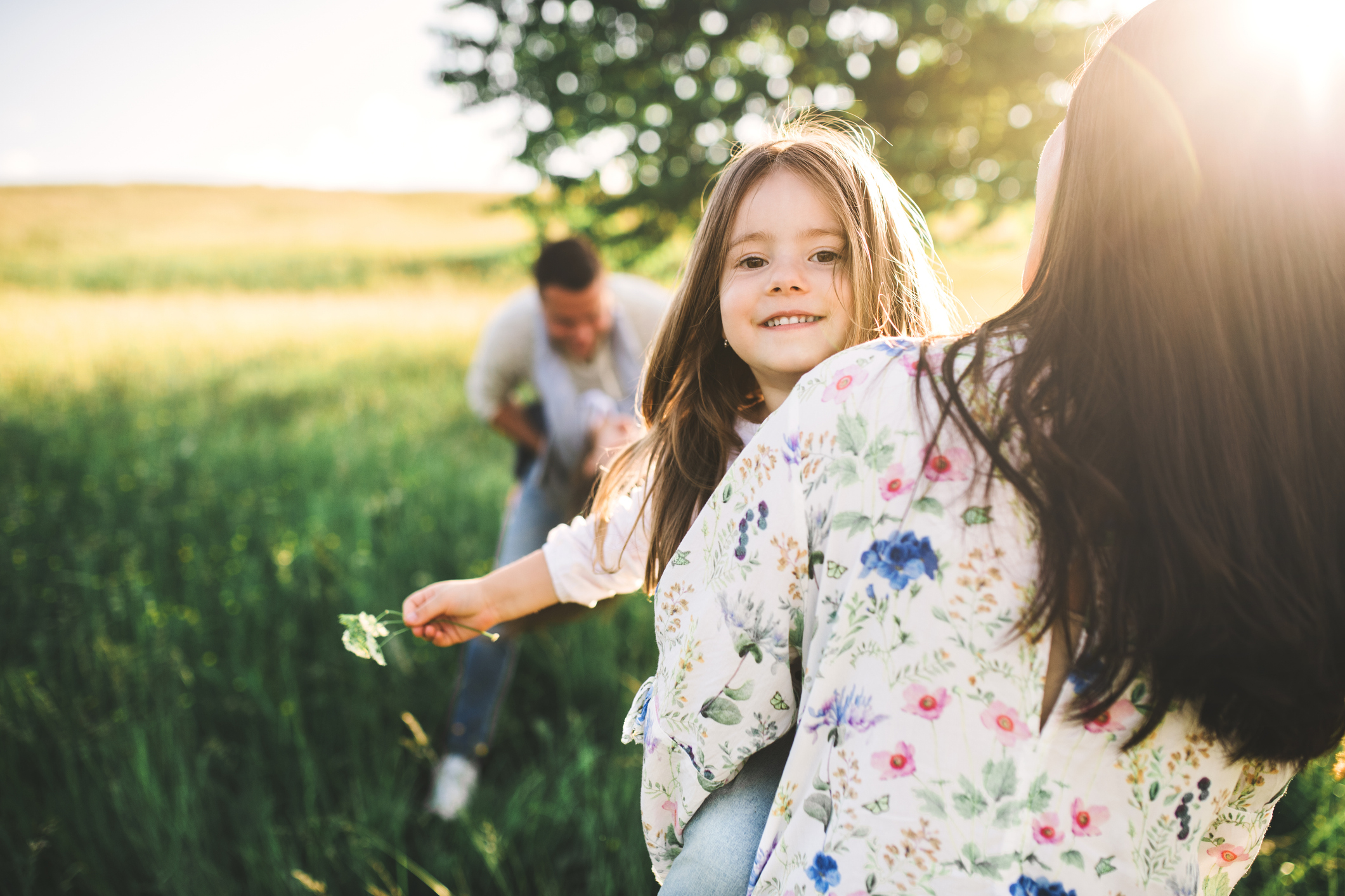 Family Hike - Happy family with two small children outside in spring nature, having fun.