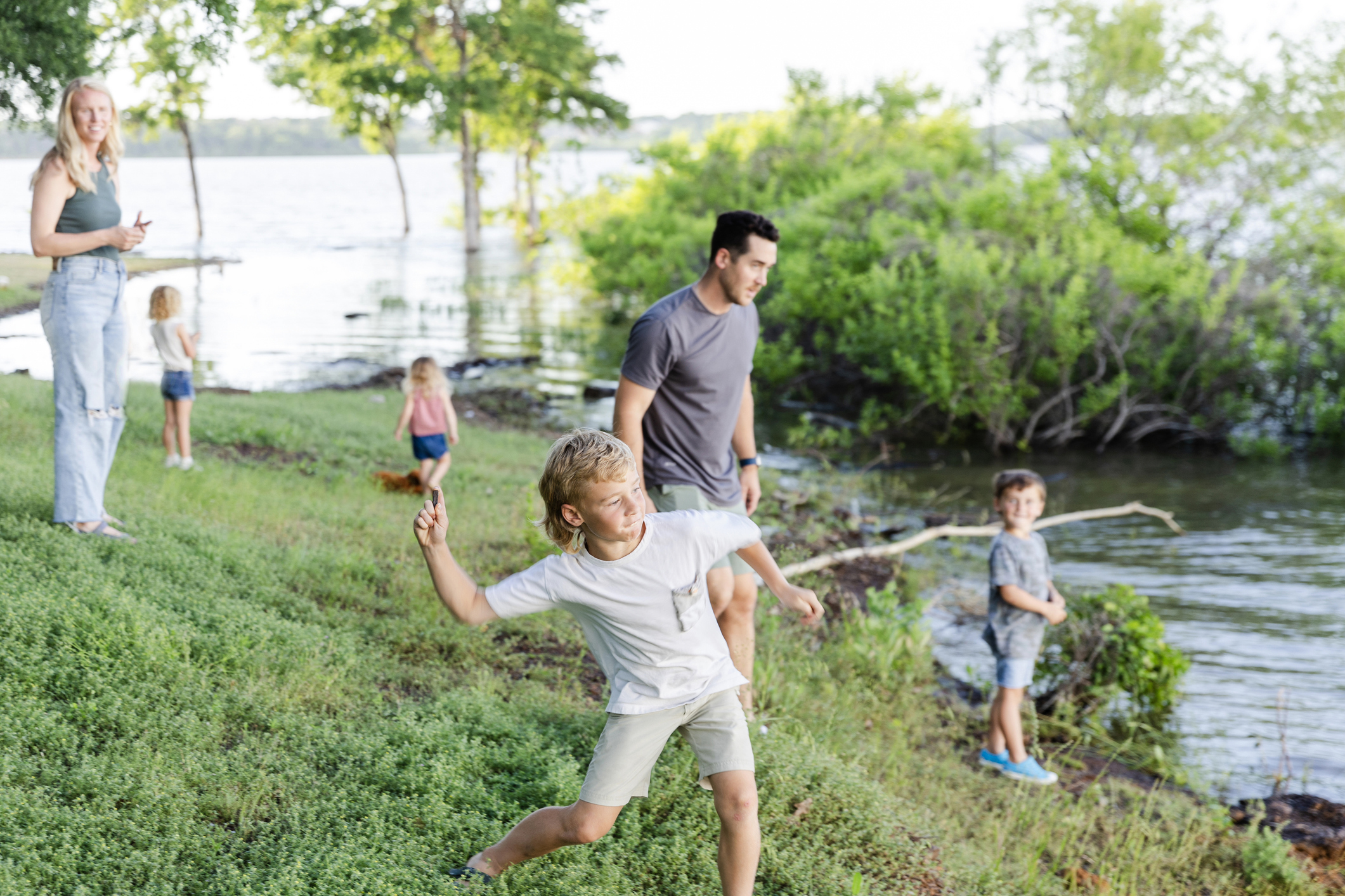 Lake Playing - Young adults and their children enjoy time by the water at the state park.