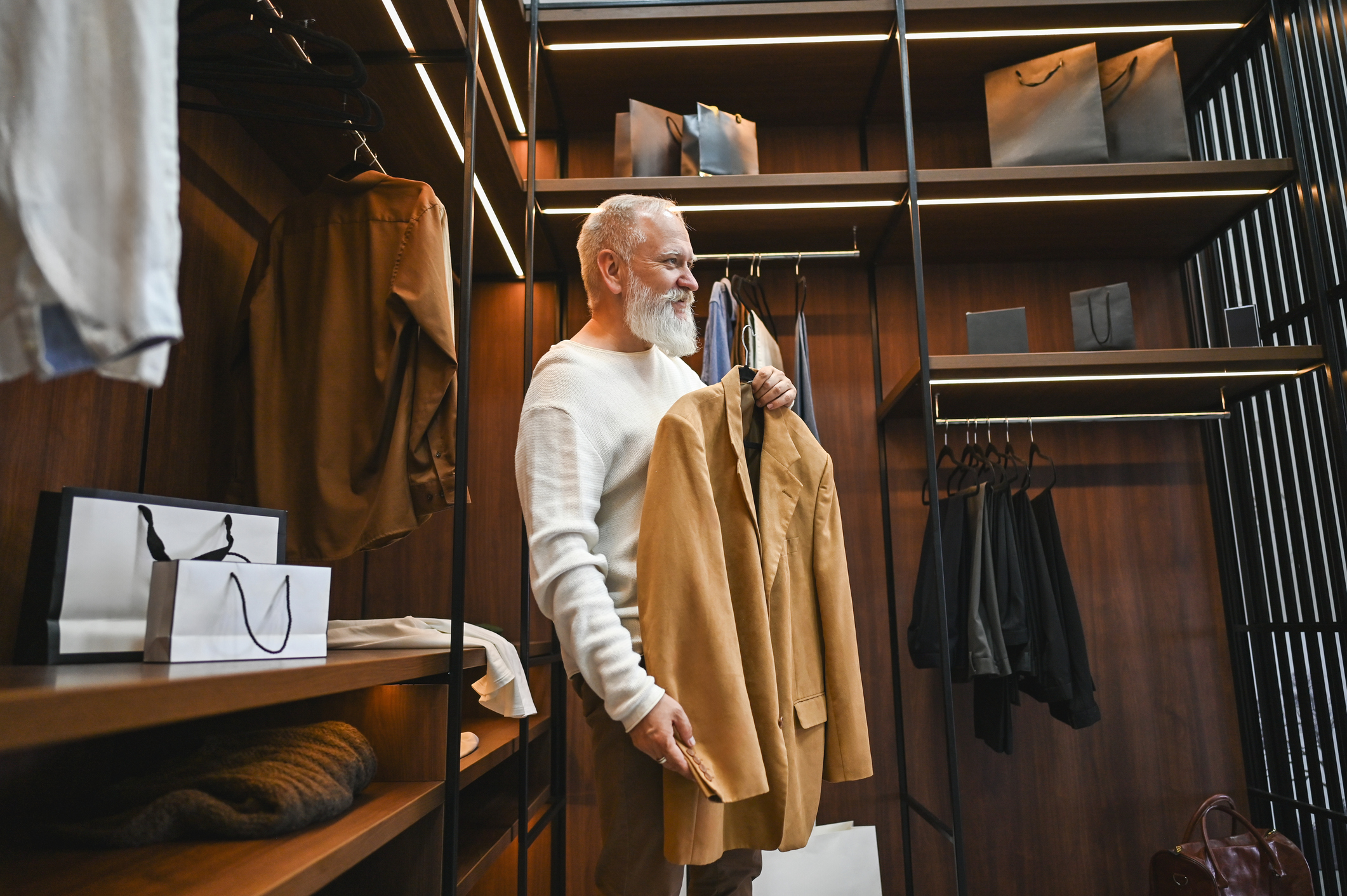 Fashion District- Senior man buying clothes at department store.