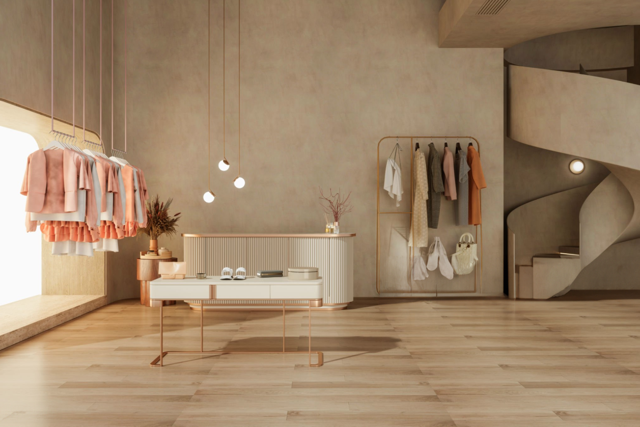 Fashion District - Interior setting with clothes hanging and a circular stair case on the side.